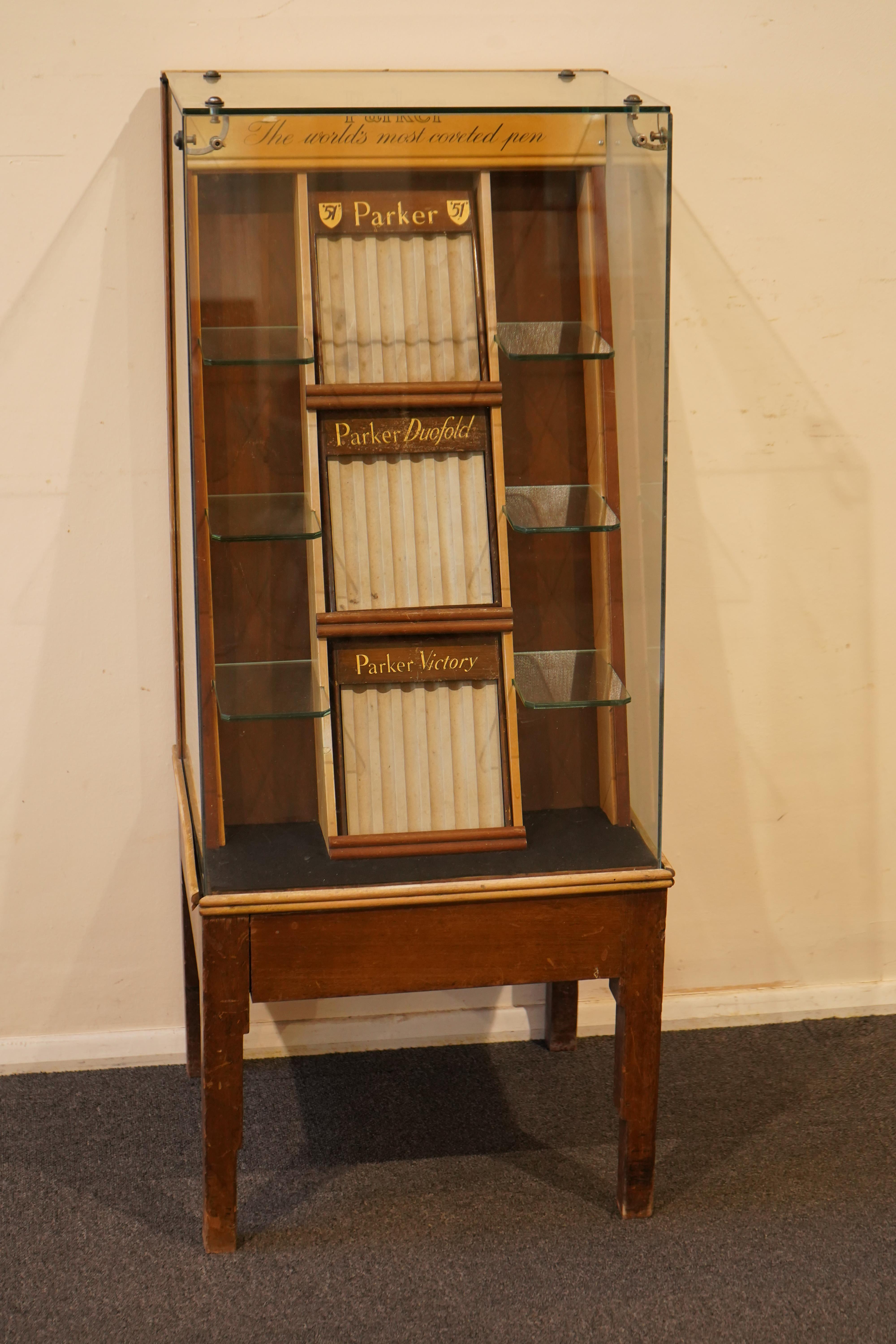 A very rare Parker Shop display cabinet, floor mounted c.1940's, with three trays and glass shelves for Parker '51's', 'Dufolds' and 'Victory's'